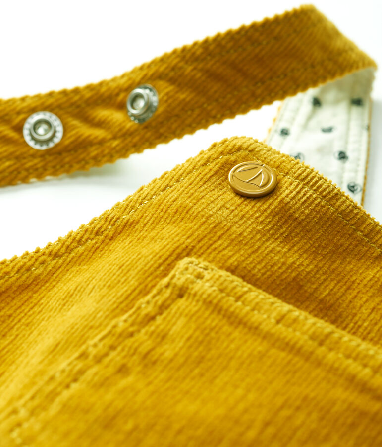 Baby-Latzhose aus Velours. gelb