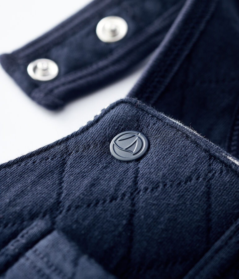 Gesteppte Baby-Latzhose. blau