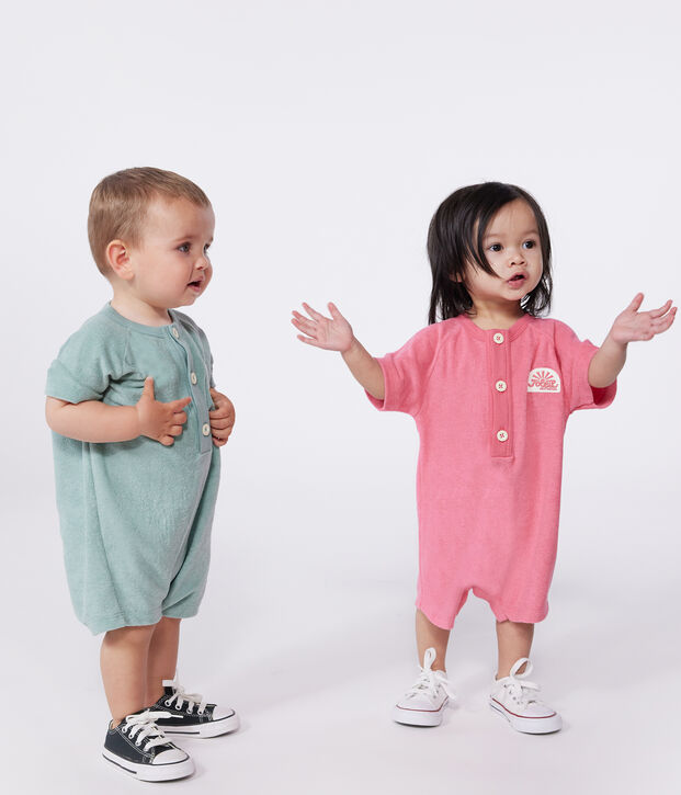 Baby-Kurzoverall aus einfarbigem Baumwoll-Frottee mit Aufn&auml;her rosa