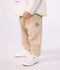 Baby-Hose aus einfarbiger Baumwolle mit Aufn&auml;her im Cargo-Stil beige