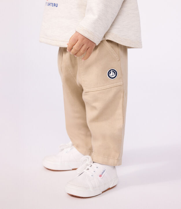Baby-Hose aus einfarbiger Baumwolle mit Aufn&auml;her im Cargo-Stil beige